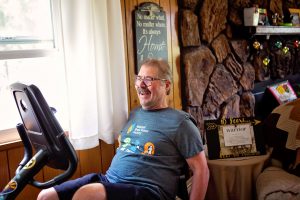 Don Sypert is a 10 year survivor of brain cancer shown here on an exercise cycle in his living room